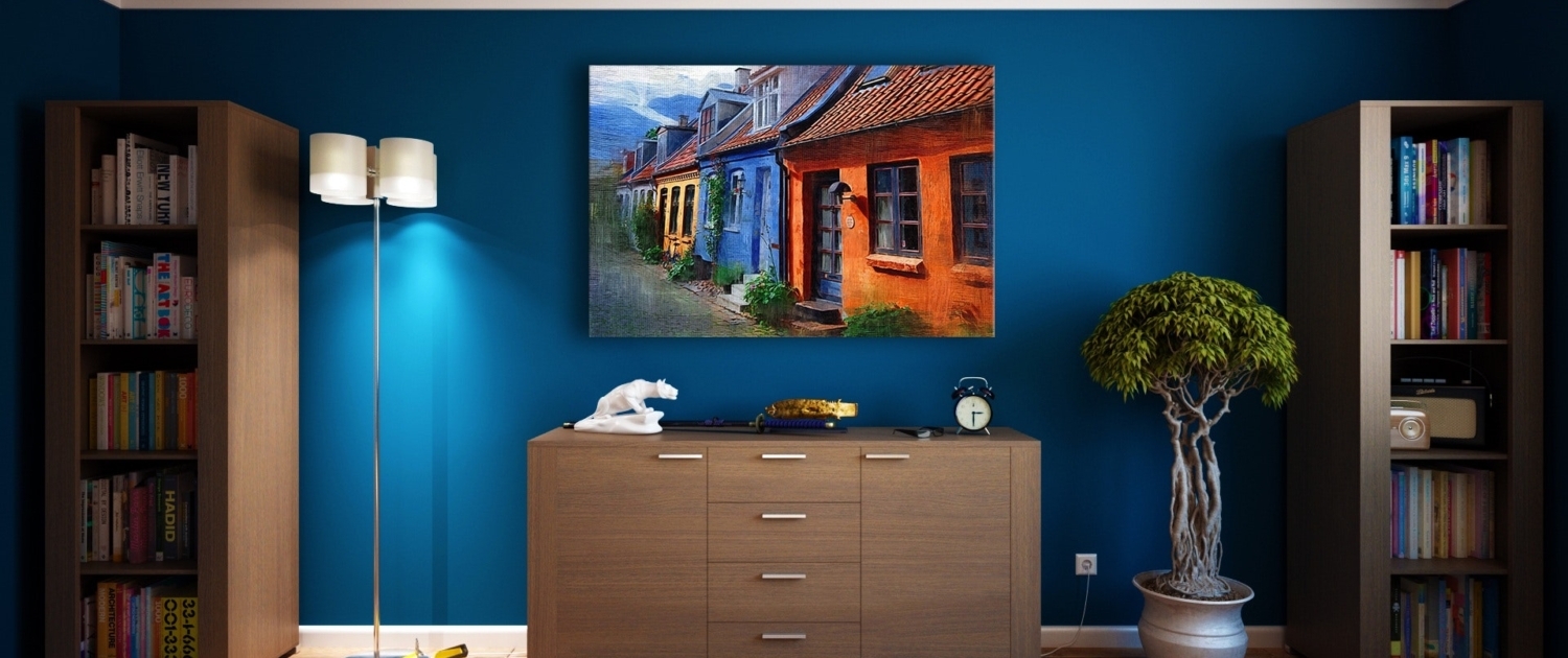 The image shows a living room decorated in blue. And walls Painted in a deep blue hue